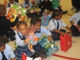 Chicago Holiday Toy Drive - Children at the Chicago Toy Drive enjoy the gifts provided by An Angel�s Calling