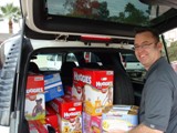 Phoenix ChildHelp Event - George Snyder hard at work unloading all the wonderful donations from An Angel�s Calling