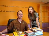 Phoenix New Day Family Center - George Snyder and Jessica Gardner organizing some of the books donated by An Angel�s Calling