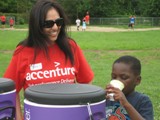 Prerna from Accenture helps ensure the kids stay well hydrated during the Boys & Girls Club event
